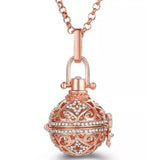 Bola de grossesse strass doré rose